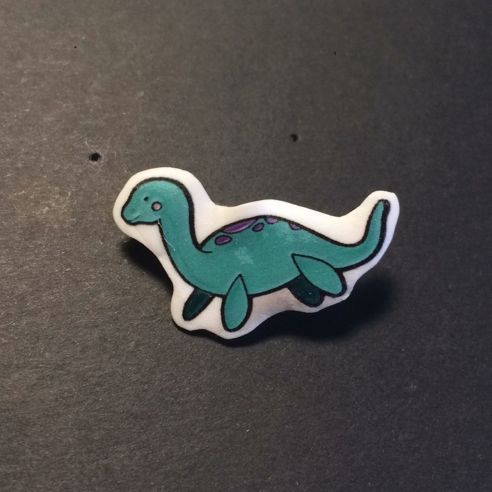 Dinosaur pin